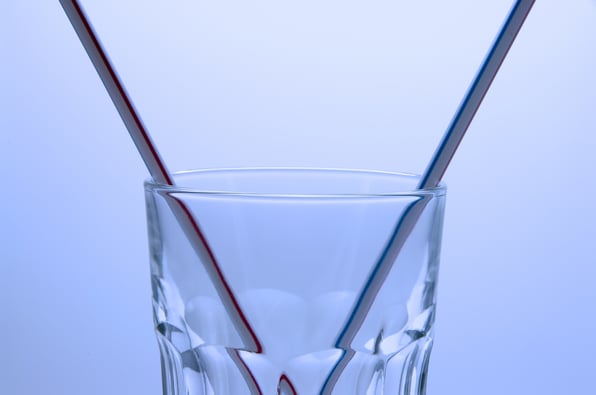 plastic straws in drinking glass